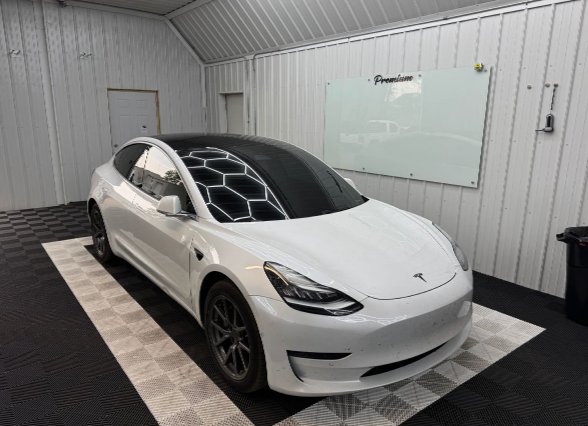 White Tesla Model 3 with professional window tint installation by Premium Auto Styling in Saint Cloud, MN